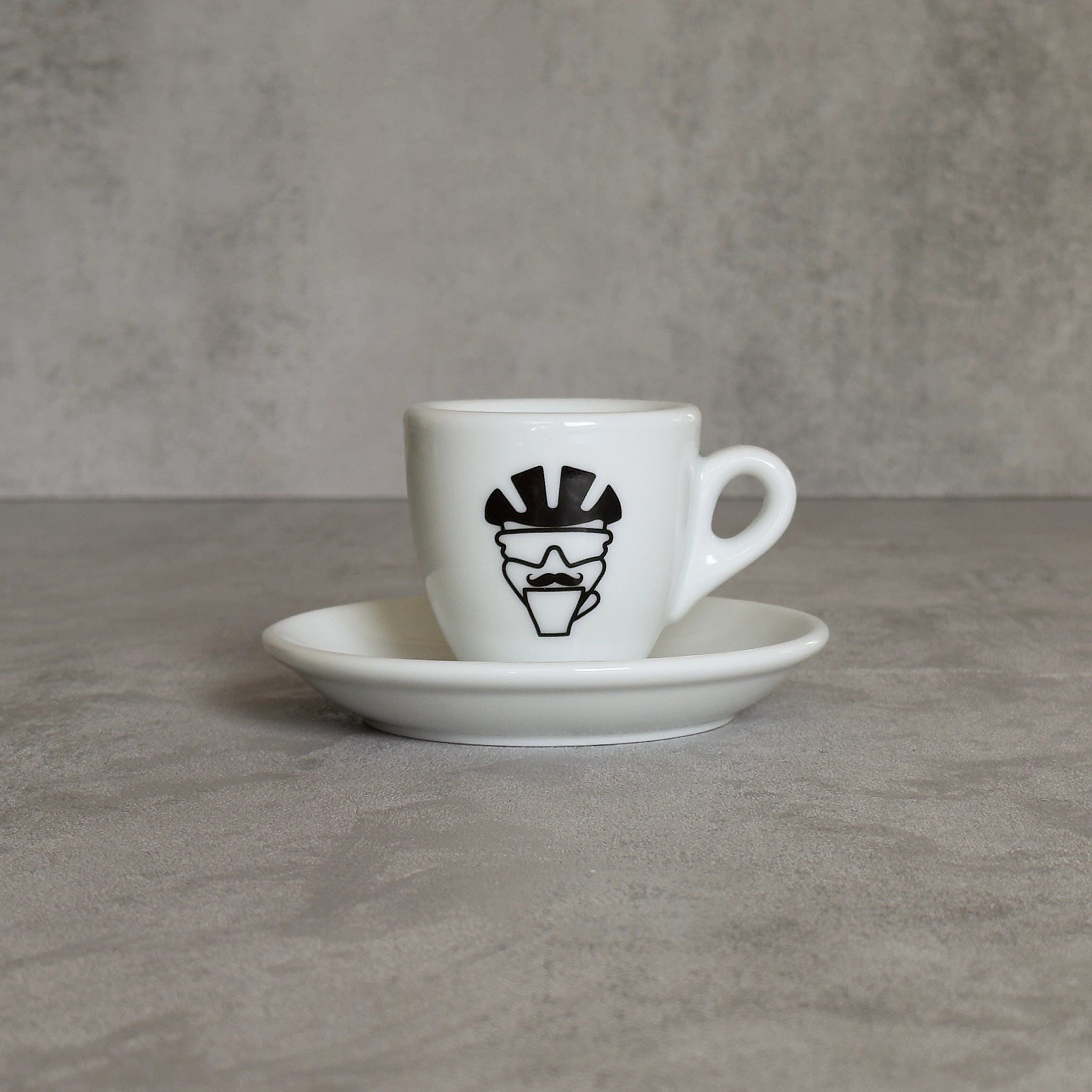 Espresso-Tasse mit Mr Coffeerider-Print: Radfahrer-Kopf mit Helm und Schnauzbart